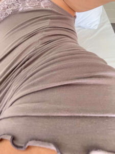 part of a body wearing a dress