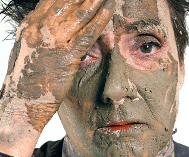a face covered with clay